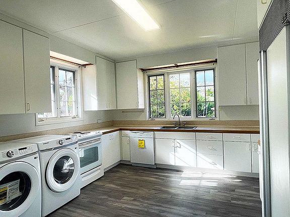 Kitchen with brand new High Efficiency Washer/Dryer, Dishwasher, Microwave, and Disposal!