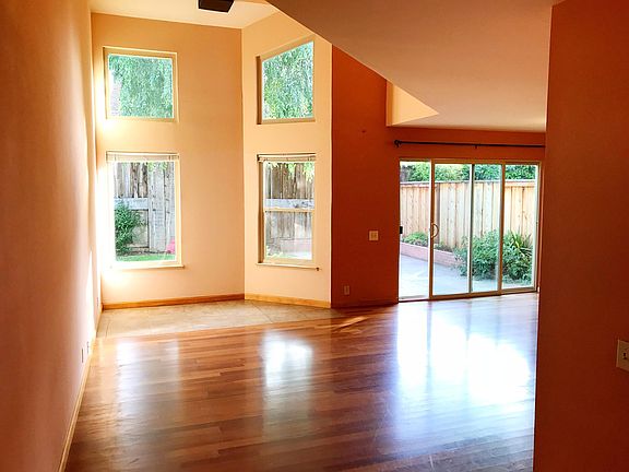 High-ceiling family room, two-toned paint and large windows