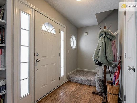 Entry foyer has beautiful wood floor.