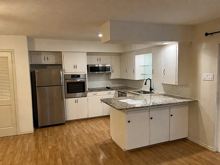 Kitchen with granite and stainless steel appliances