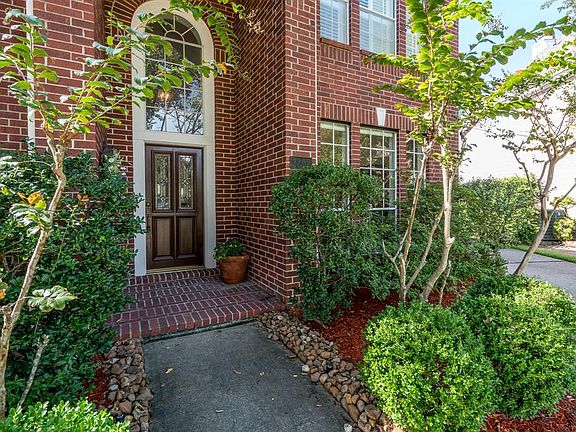 A stately traditional brick elevation welcomes your guests as the come up the pathway to the leaded glass front door!