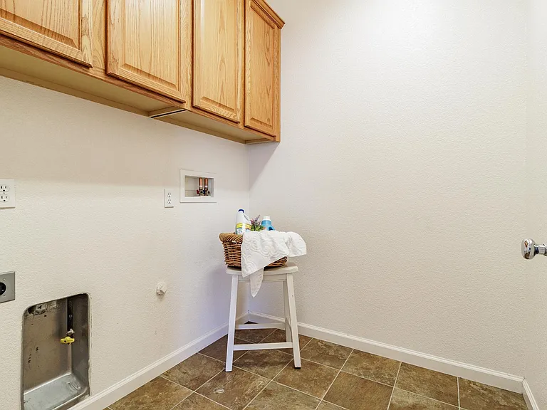 Laundry room is can accommodate gas or electric dryer.