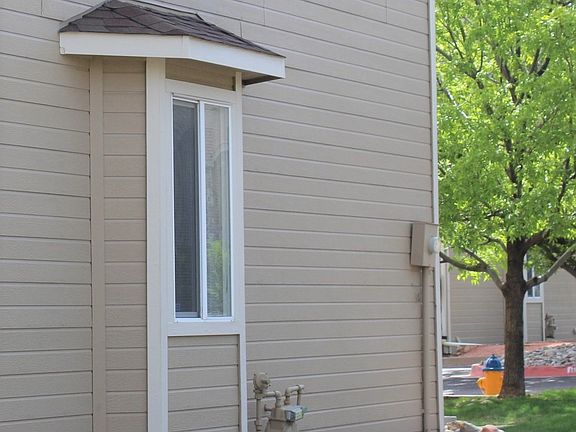 End unit with trees & grass