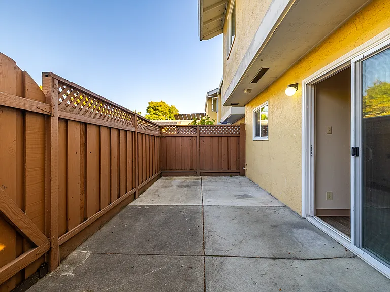 Private fenced patio perfect for outdoor dining, gardening, or relaxing in the fresh air.