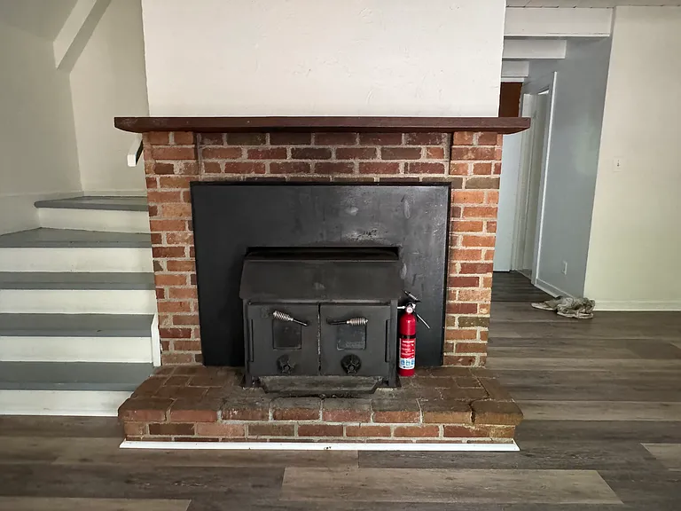 Stairs on the left lead to upstairs rooms