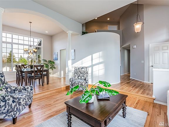 Sunken Living Room with Hardwood Floors, Vaulted Ceilings and Gas Fireplace