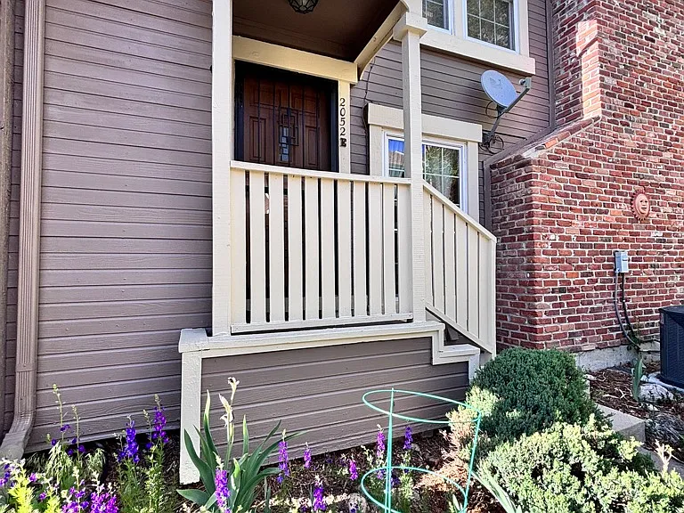 Freshly painted exterior with landscaped entry and great natural light