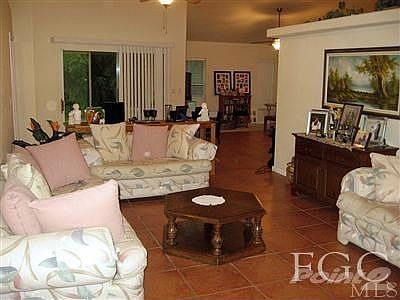 Spacious living room with view to patio.