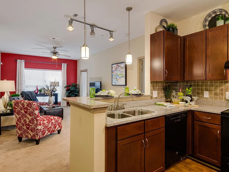 Open concept Living and Kitchen with deep sink and goose neck faucet