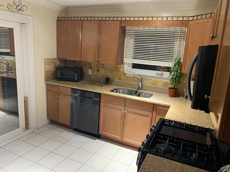 Kitchen that leads into backyard deck.