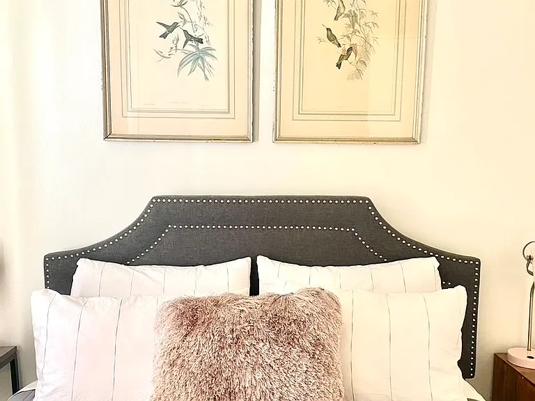 Queen Bed with new memory foam mattress and organic cotton sheets. There is a window AC for the warm months in the BR, and a mini split in the Living Room.