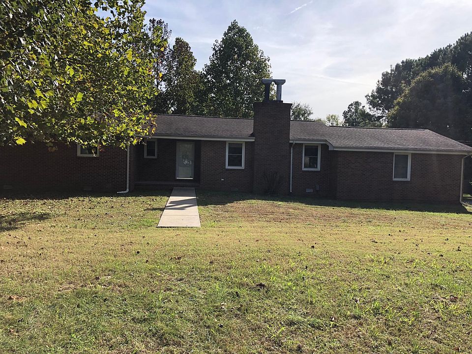 Front of the House with All Brick, Nice newer windows, Huge Yard, fence on each side and in back.