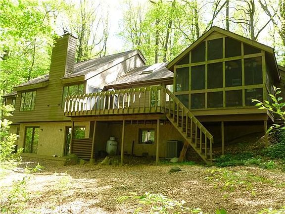 Rear view overlooking wooded acreage