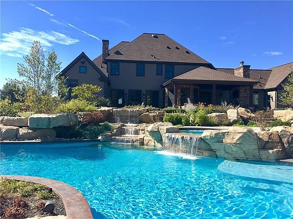 Sit back and relax in your backyard paradise listening to your waterfalls.