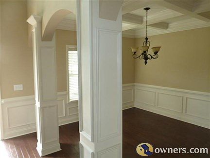 Dining Room with beautiful coffered ceiling and wainscoting