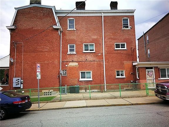 Side of property with front entrance on the right.