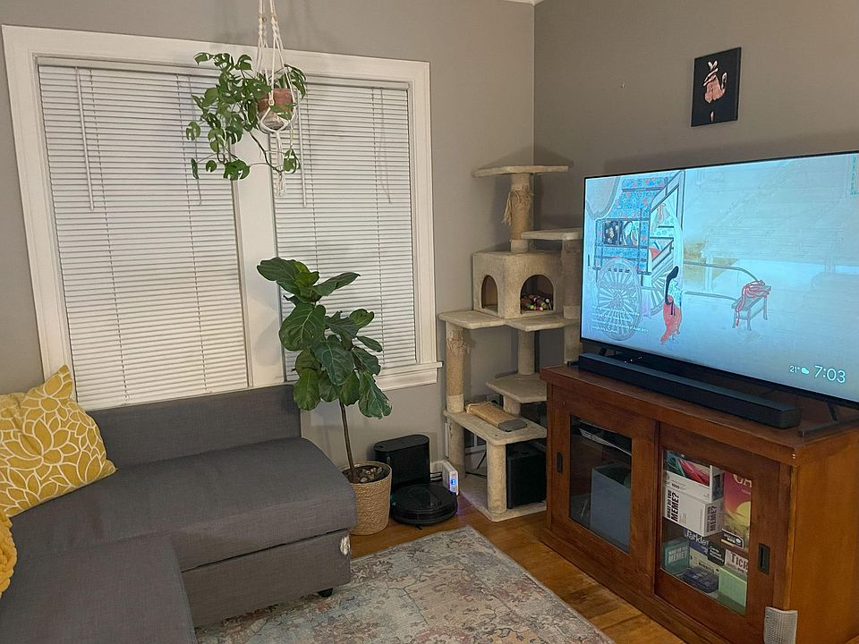 Livingroom with original hardwood floors and window views