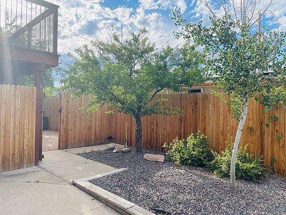 Back yard with fence entrance to back patio