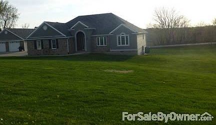 Kitchen
						:
						Island has onyx top, hardwoods through the kitchen and dining room.