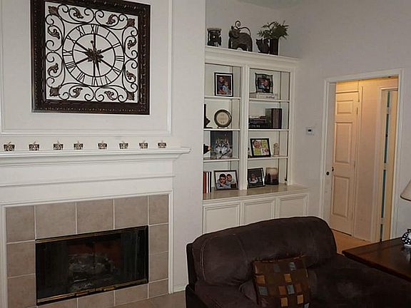 FAMILY ROOM ALSO FEATURES CUSTOM BUILT-INS!