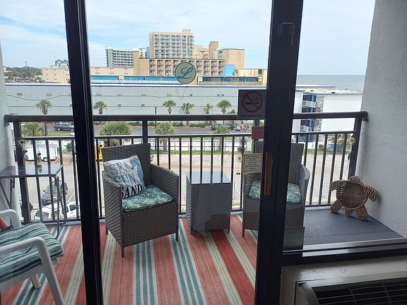 Balcony. Great wide beach when looking right. (I can send better views for you)