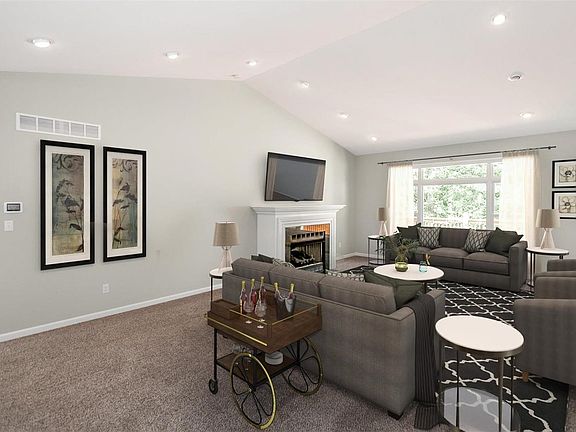 Great Room with large window and plenty of natural light. 12 directional can lights on dimmer switches for your relaxing and enj