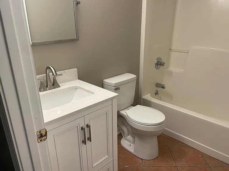 Freshly updated bath with tub/shower combo and a great sink and vanity