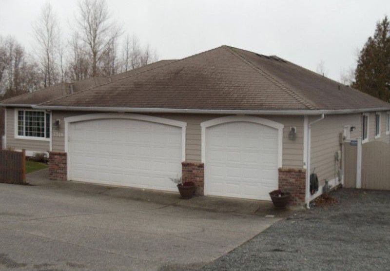 Exterior of home showing 3 car garage and RV parking.
