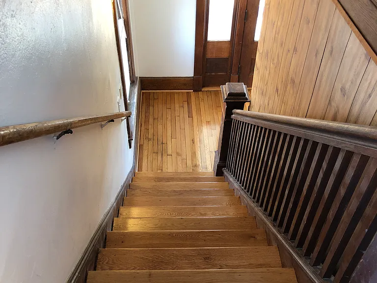 Landing looking down stairs to foyer