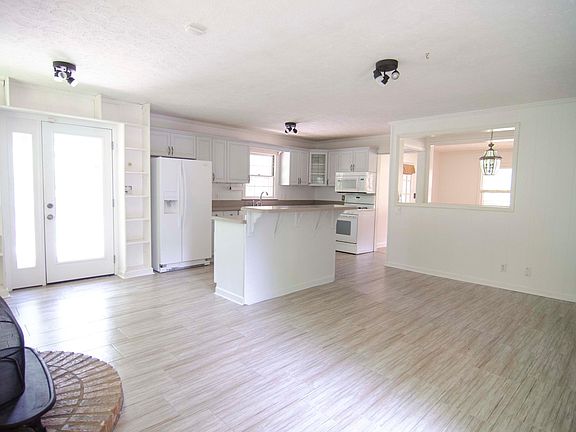 Open kitchen with large living and dining flex space