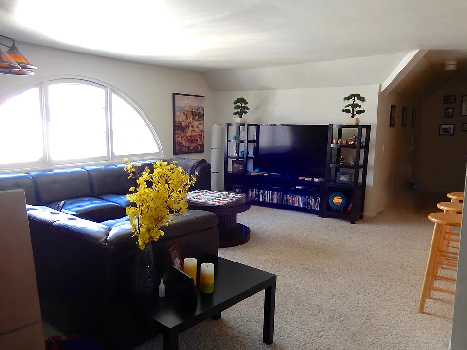 Living Room with large, antique fan window