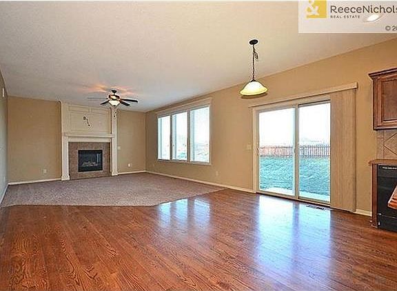 Big open eat-in kitchen/living room space.
