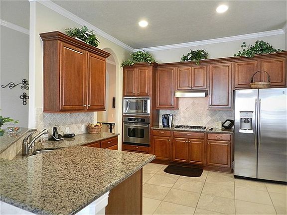 Spacious kitchen with granite counters, stainless appliances, etc.