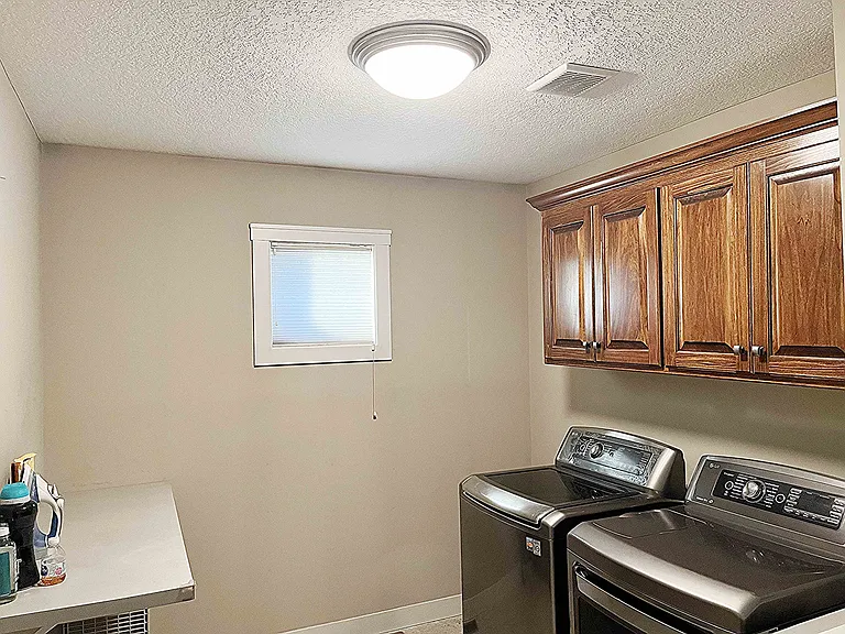 Large Laundry with Iron Area and Custom Cabinets