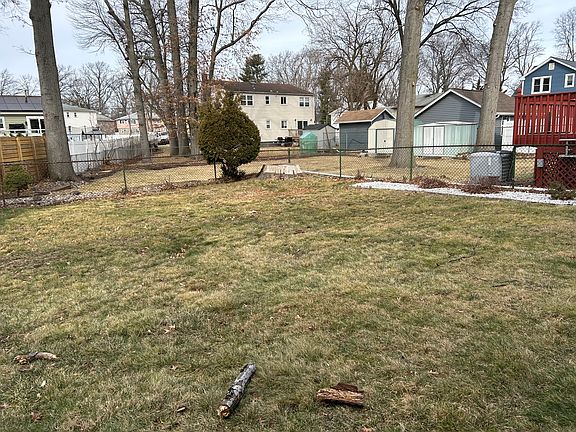 The backyard is generously sized, perfect for entertaining or relaxation.