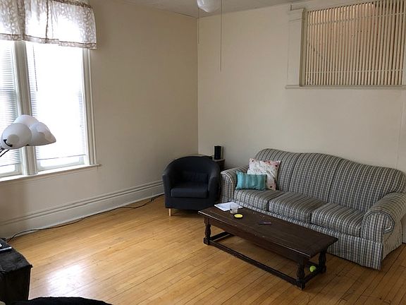 Living room with big windows and hardwood floors!