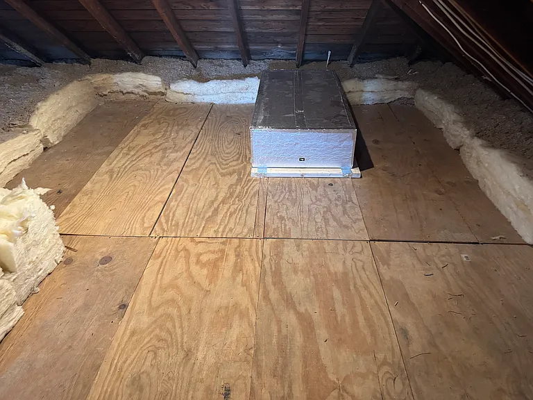 Attic Storage access vis pull down stairway from back hall.
