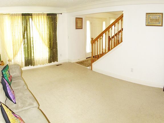 Living room or bonus room to utilize as an office.