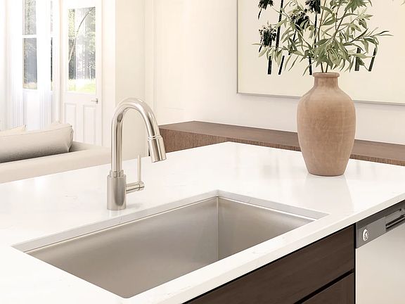 Kitchen with stainless steel faucet