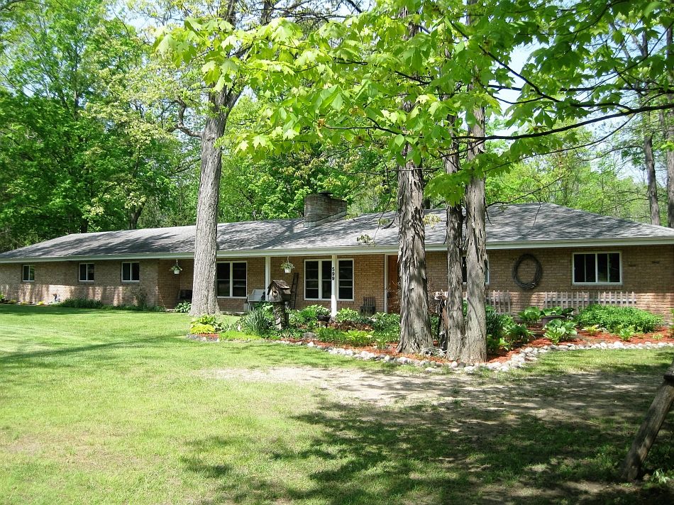 Awesome expansive ranch on 1.36 acres in the country. Enjoy the yard with a peaceful creek meandering through the back yard, a beautiful view. No flooding issues. This area of lovely homes is in the Midland school district too a great place to raise a family. There are lovely red oak custom kitchen cabinets with CORIAN counter tops, stainless steel double oven and dishwasher  A beautiful knotty pine cathedral ceiling heated and insulated sun room, with skylights and patio doors to the large deck. Family room with coved ceiling, a a fireplace and living room to spread out for lots of room.  4 bedrooms with cedar closets, nice 6 panel doors and 3 baths. The fact that the owner is a heating contractor benefits this homes buyer.There is a 5 zoned boiler and a top of the line central air system. He also has an external wood burner to heat the whole house, lots of savings. 2 electric boxes, newer septic, windows and roof give peace of mind. Extra lot with gravel drive, 2 storage sheds