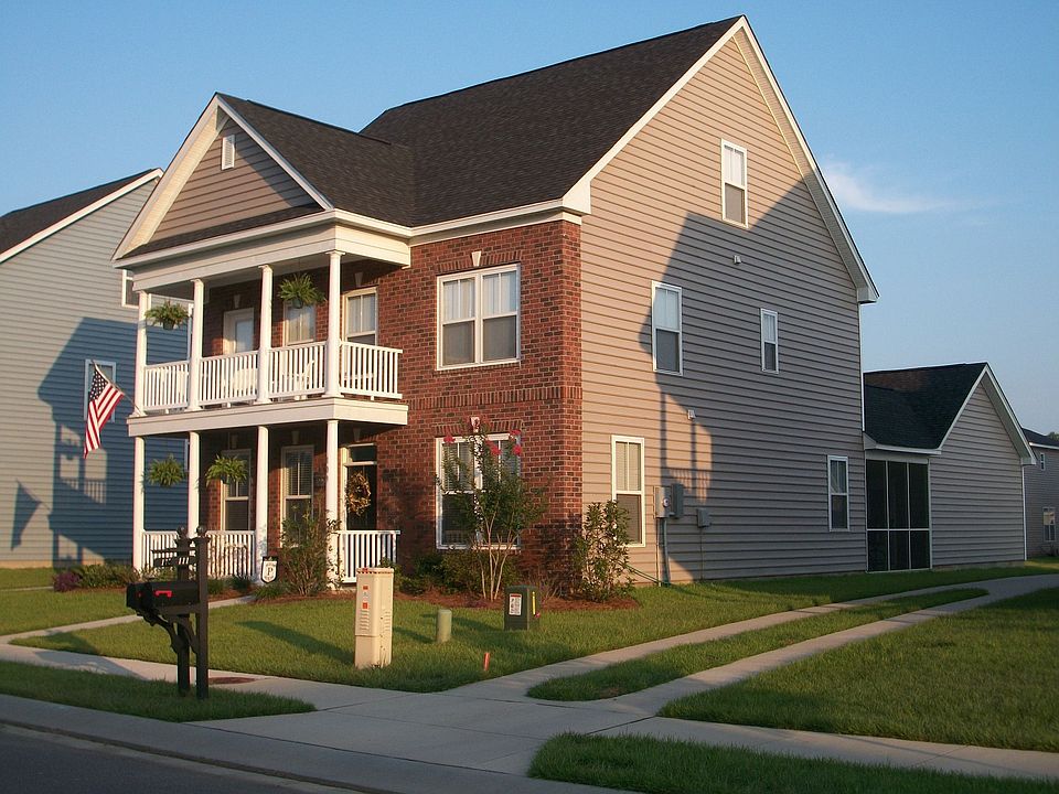 Exterior with beautifully landscaped yard