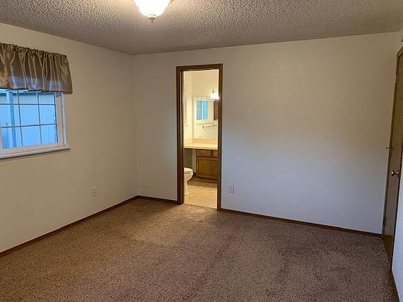 Master bedroom looking into master bathroom.