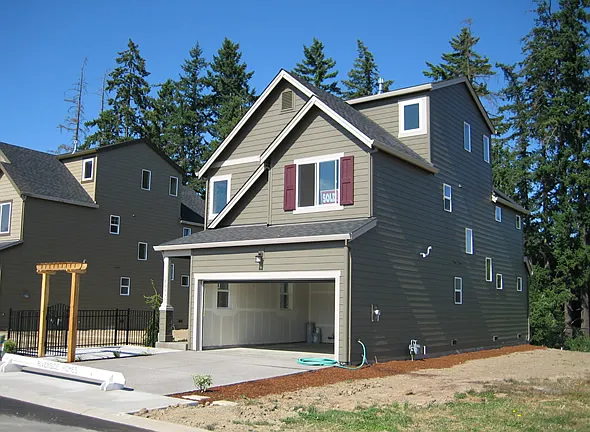 Captured when new. Showing all 3 floors with garage and driveway.