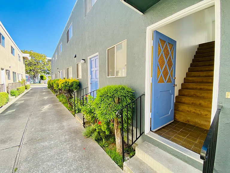 Front door entrance. Stairway.