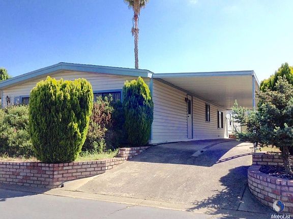 DOUBLE WIDE WITH 2 CARPORT SPACES