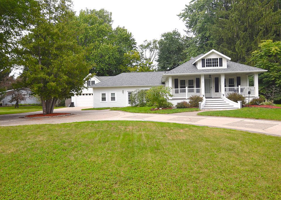 Impressive is the word that will come to mind as you pull into the circular drive!  The entire home has been beautifully remodeled and updated, including new roof, windows, siding, garage & mudroom, drywall, gorgeous bathroom, furnace, hot water heater, central air, electrical upgrade (wired for generator), concrete circular driveway, waterproofed basement with egress, patio, sprinklers, 2 car heated garage with workshop & 12' x 31' loft and a fenced-in backyard!