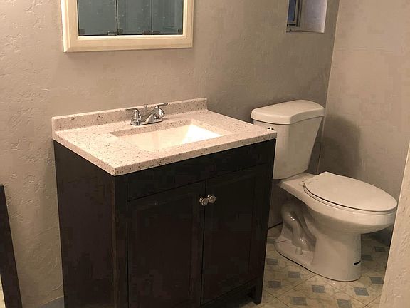 New vanity, toilet and shower-head.  Large storage closet wi