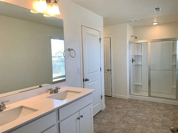 Master bath with his and hers sinks