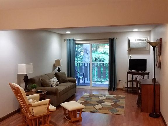 living area includes queen size pull out couch, sliding glas