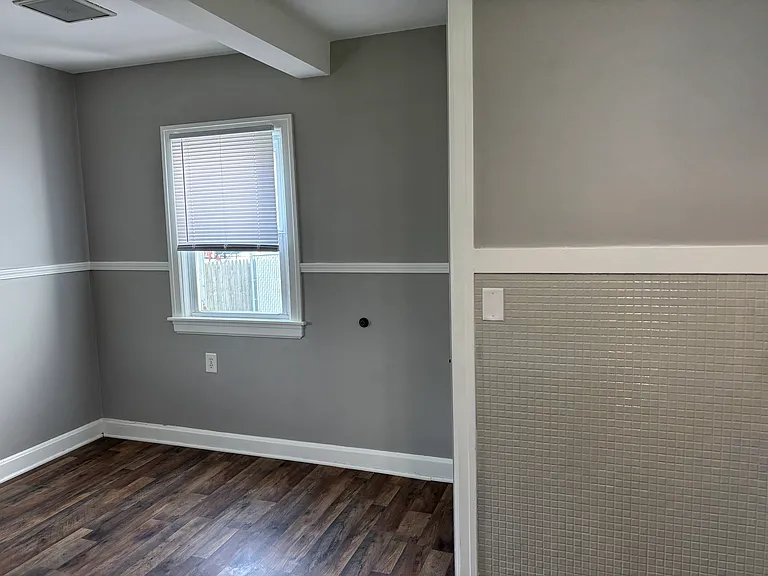 The view of the breakfast nook from the wall of kitchen appliances